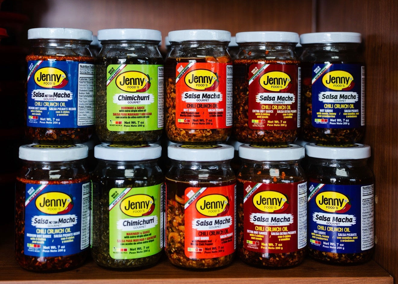 Jars of Jerry's salsa on a wooden shelf